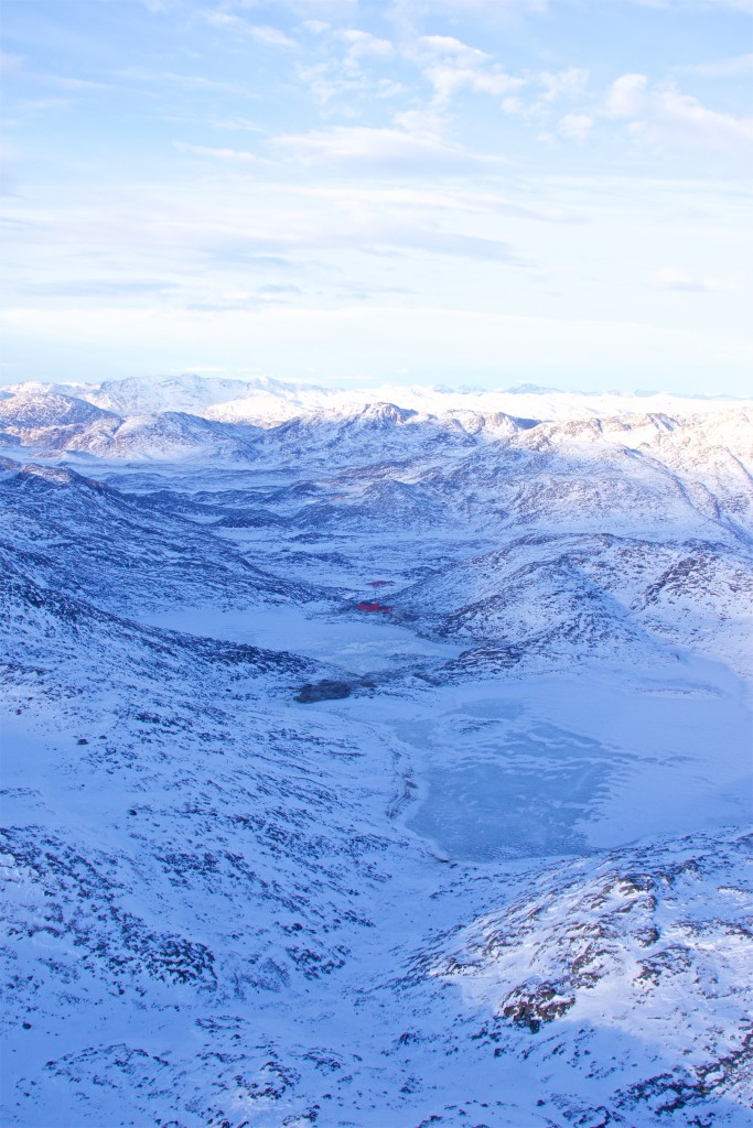 Aerial view showing the start of operations within the Aappaluttoq pit (Centre); the Process Plant & Workshop are in the near-distance, and the camp in the far-distance